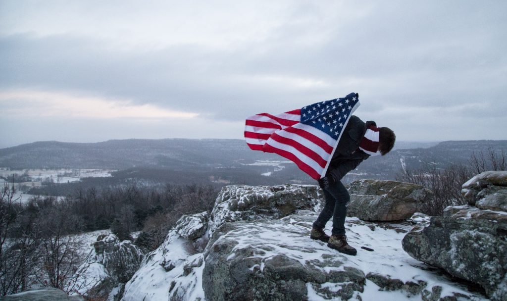 american-flag-guy-on-mountain-1280x760