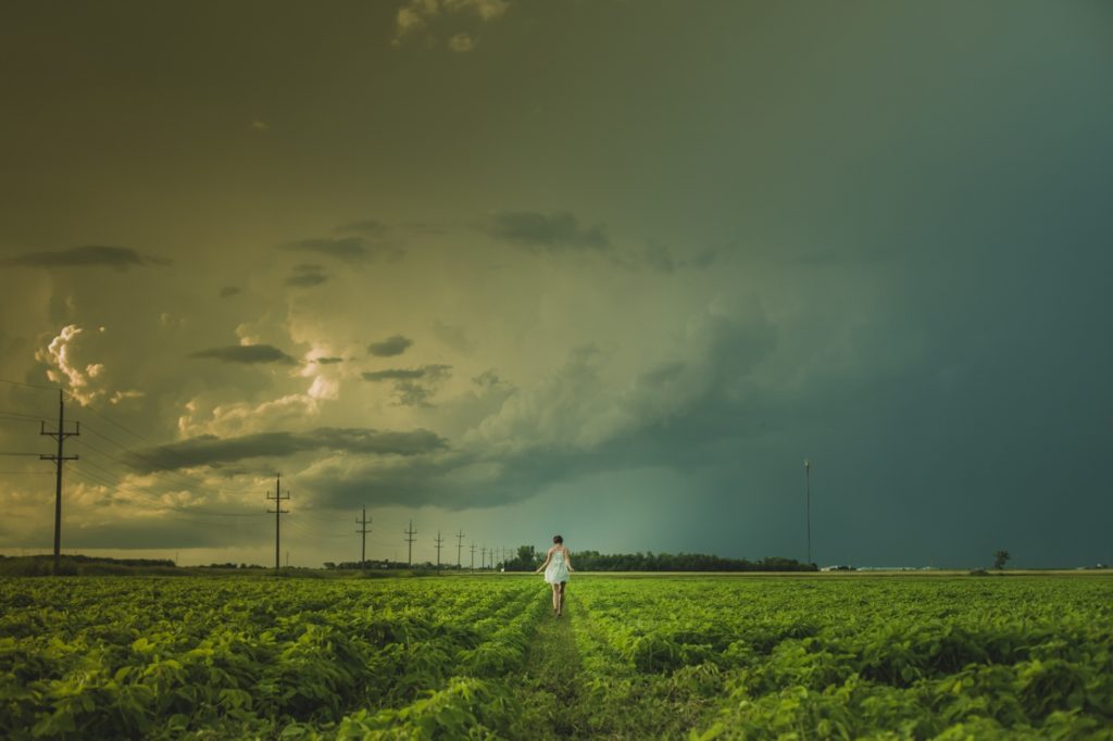 woman-in-field-running-away (1280x853)