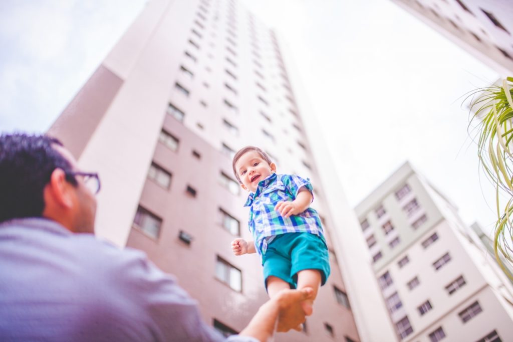 child-balancing-on-dads-hand (1280x853)