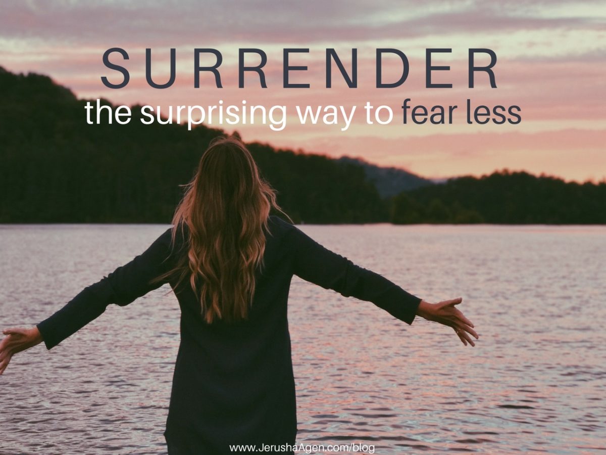 Woman with arms outstretched in surrender