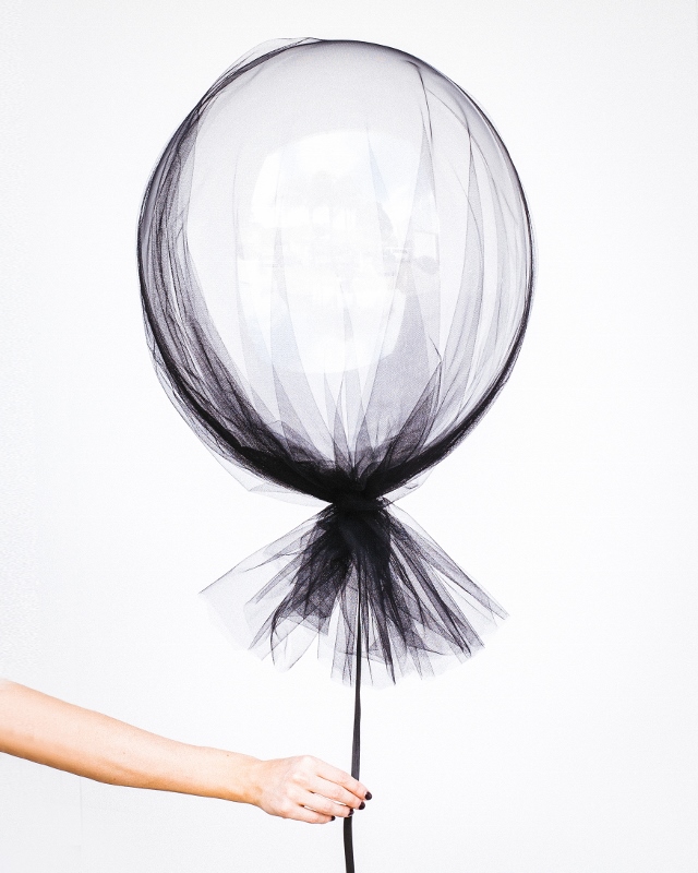 Balloon covered with black shroud