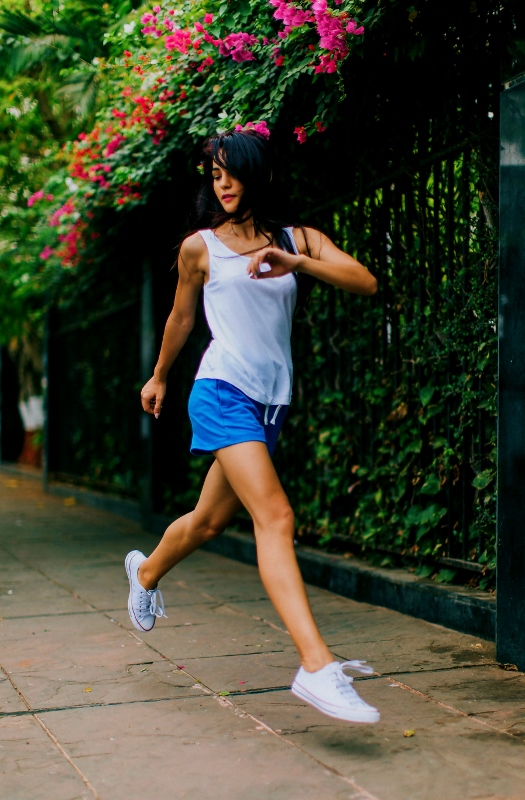 woman running workout on sidewalk